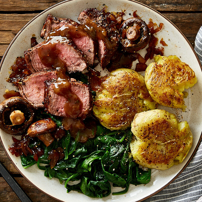 Top Sirloin Steaks with Smashed Yukon Potatoes, Spinach and Three Peppercorn Sauce